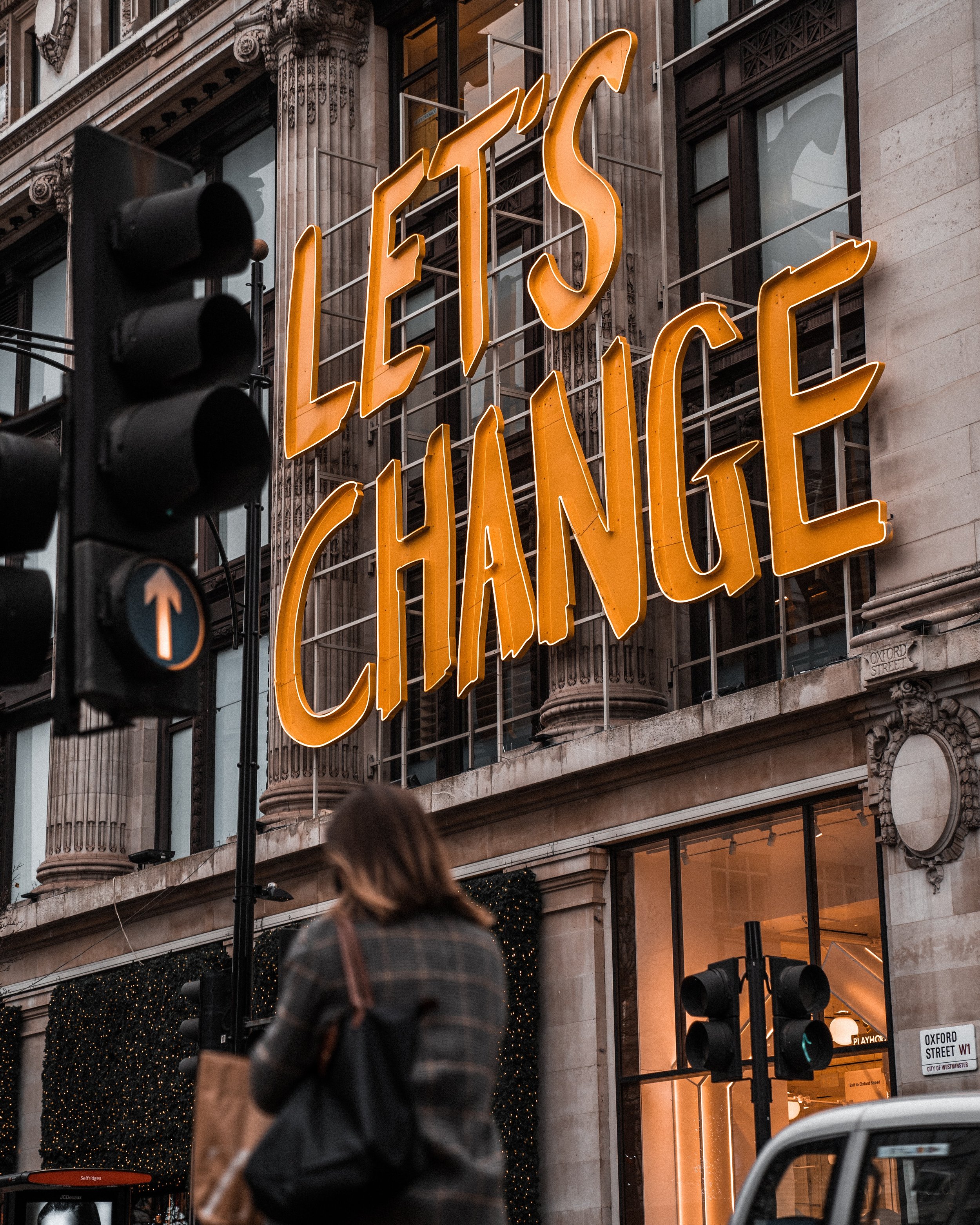 Image of a large "Let's Change" sign on Oxford Street in London