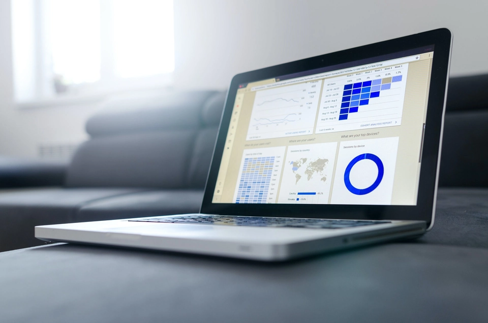 A laptop displaying datapoints and charts